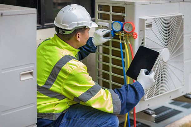Professional Ac Installation technician working in Deatsville, AL